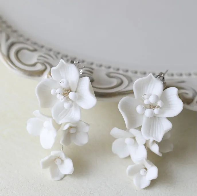 E188. bridal earrings, made with clay flowers.